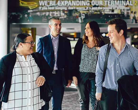 Group of professionally dressed workers walking