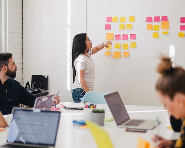 Meeting with many post-it-notes on the wall